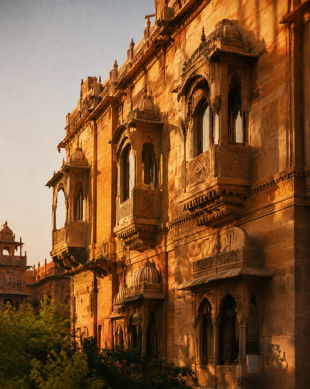 An arched sandstone corridor in soft morning light